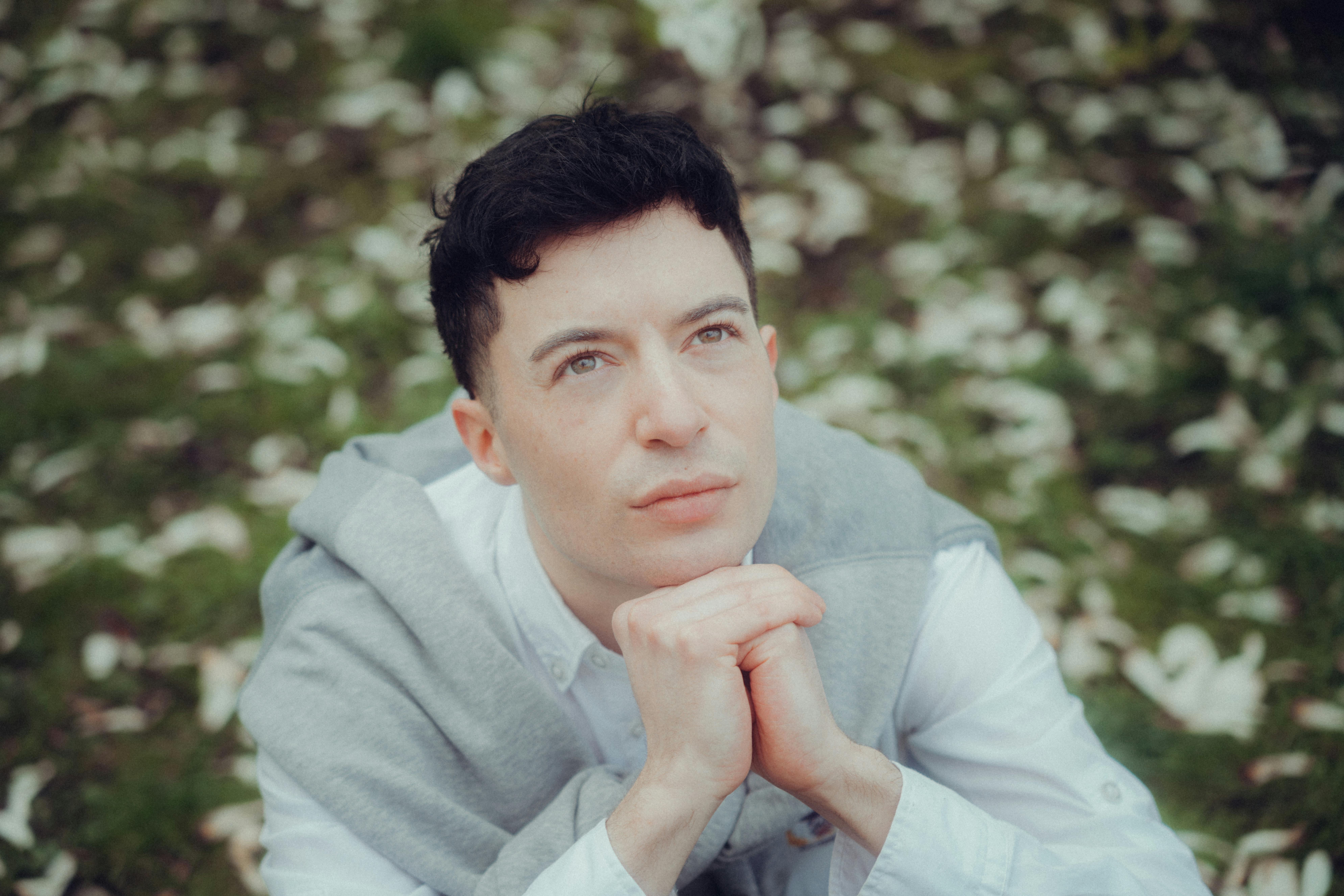 A serene image of a person sitting calmly, reflecting, with soft natural light. - mentalization based therapy for narcissistic personality disorder