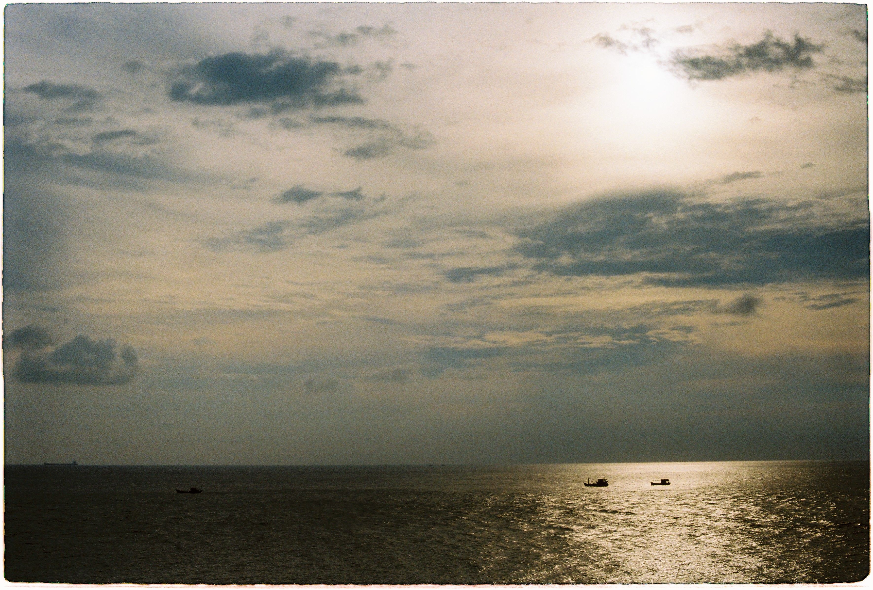 Clouds over Boats on Ocean at Sunset · Free Stock Photo