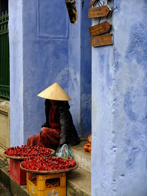 Person Sitting in Front of House