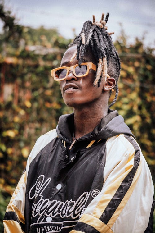 Portrait of a Male Model Wearing Sunglasses and a Hoodie