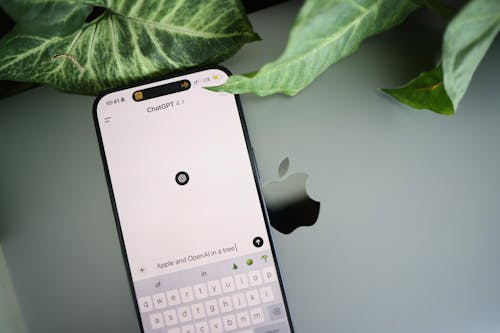 A close up of an iphone with a keyboard on it