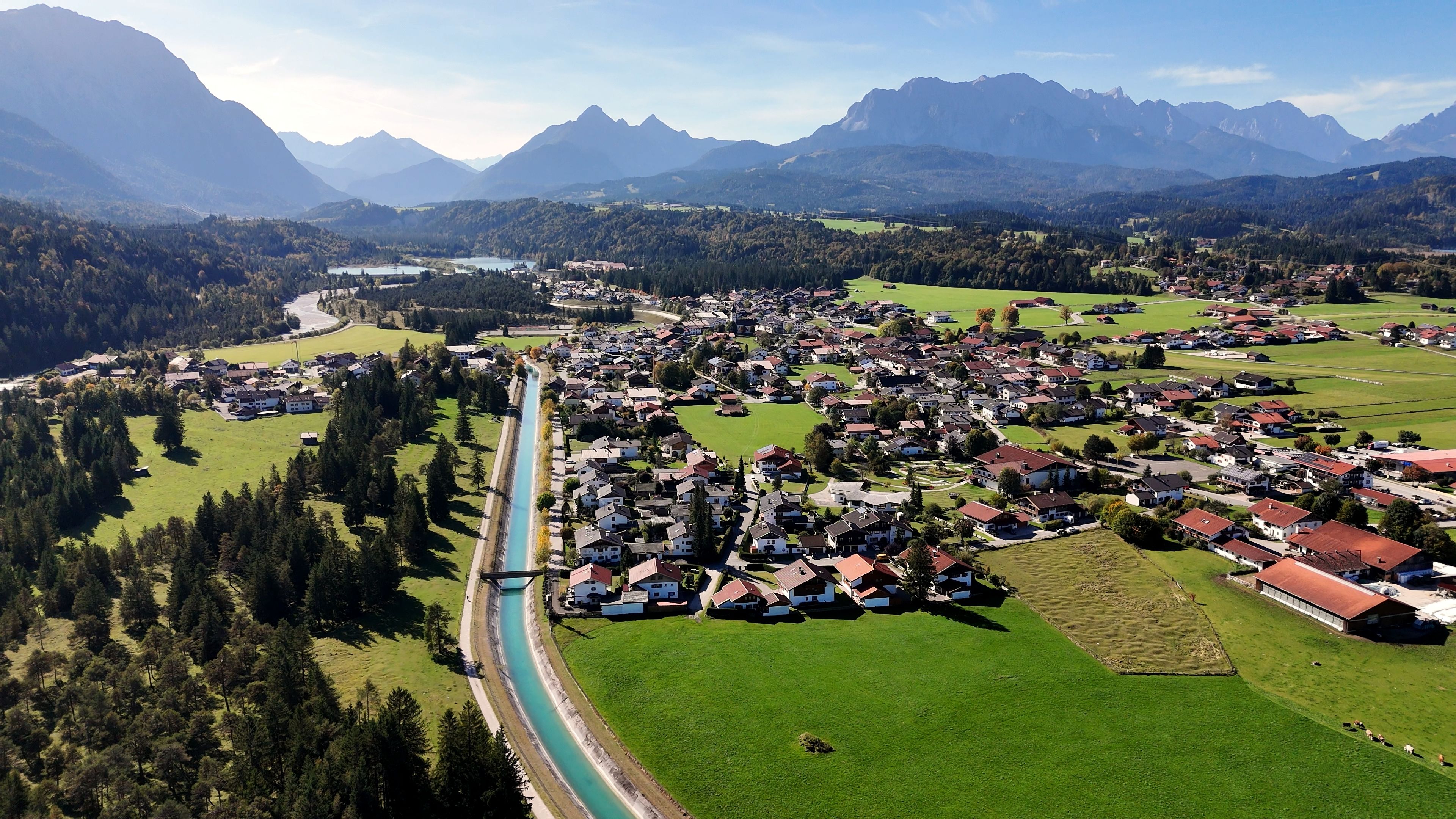 Bird's eye view of Krün, Bavaria, showcasing lush landscapes and mountains.
