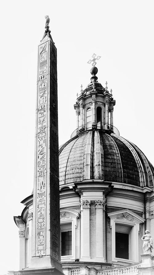 Obelisk near Church in Black and White