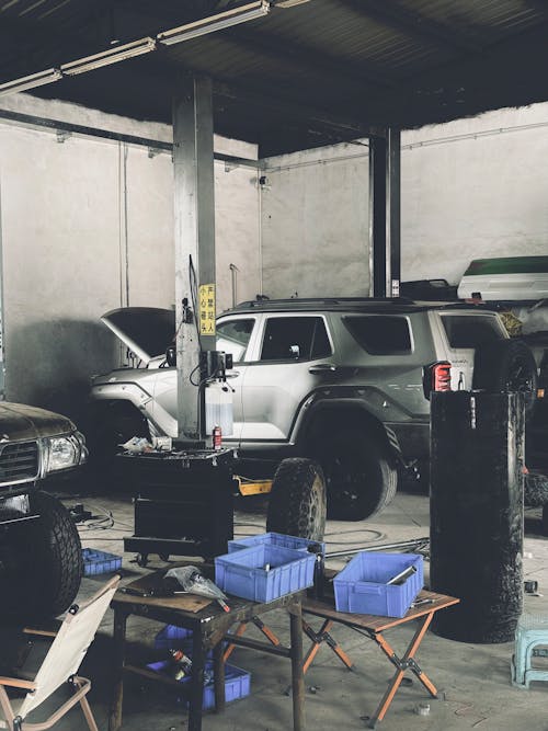 A garage with a car and a truck in it