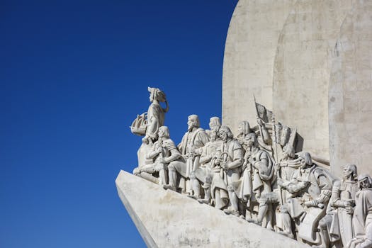 White marble statues of explorers at Lisbon's iconic Monument of Discoveries, Portugal.