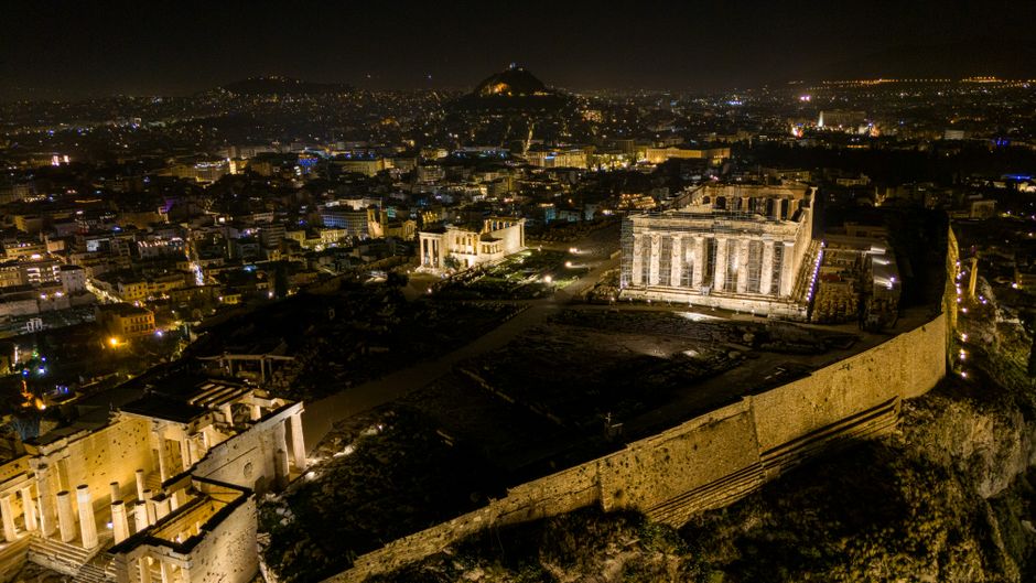 Best Private Helicopter Transfer from Paros to Santorini Review 2026 - Stunning aerial shot of the Acropolis illuminated at night, overlooking Athens.