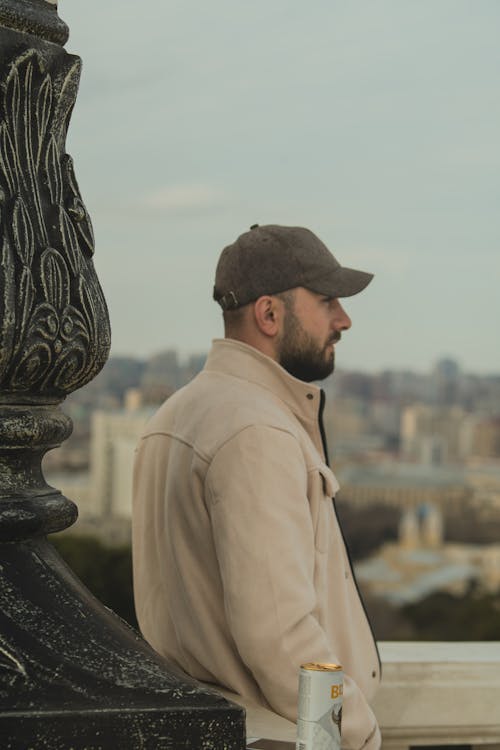 Man Wearing Cap in a City