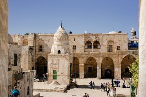 People Strolling at the Ancient Building