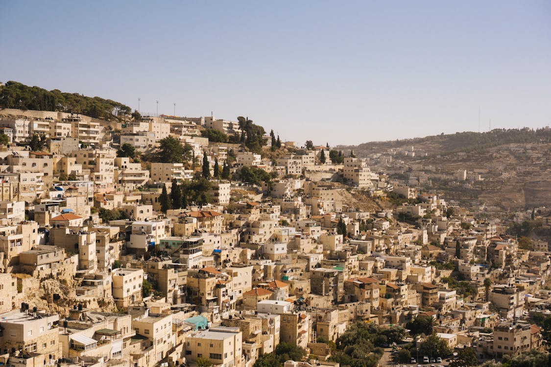 Free Beige Concrete Buildings on High Ground Stock Photo