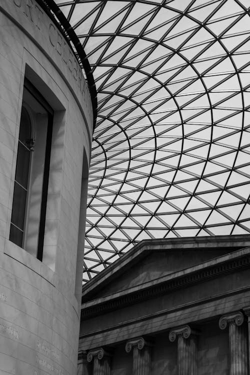 Black and White Photo of Glass Dome above Classical Building