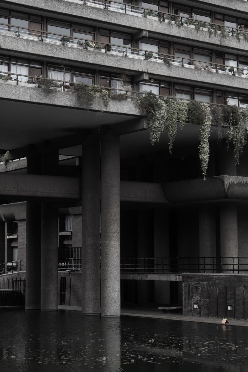 Explore the iconic Brutalist architecture of London with reflective water features in this urban scene.. pexels, explore, ico