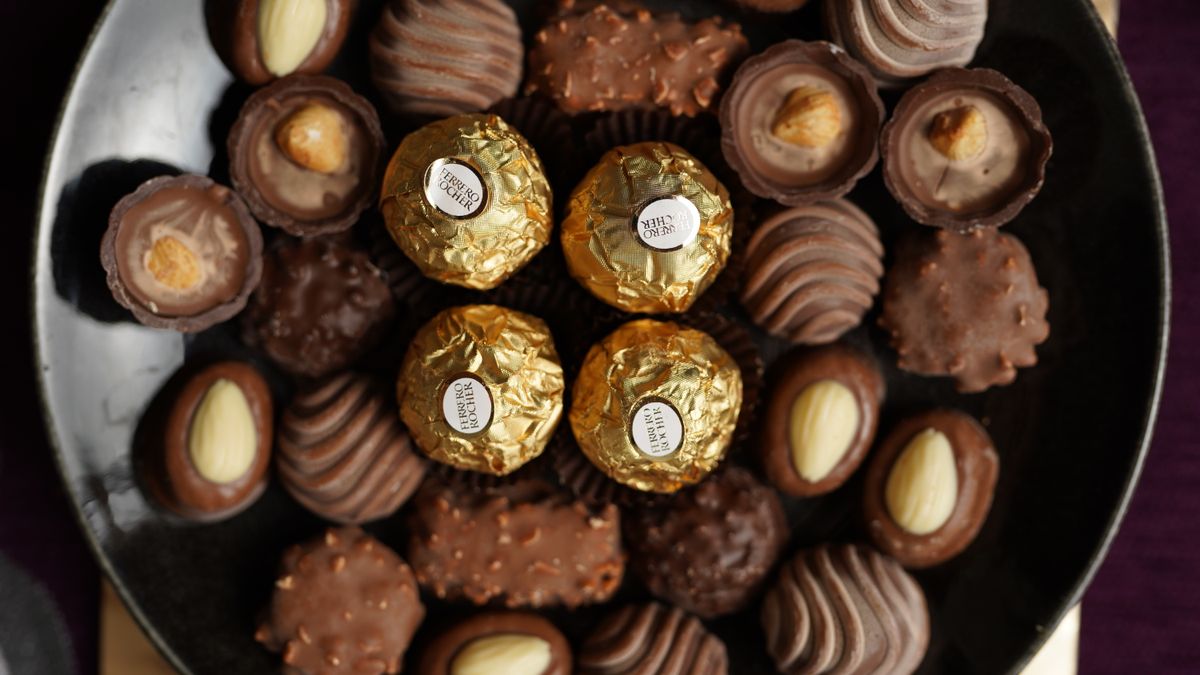 Top view of various gourmet chocolates beautifully arranged on a plate.