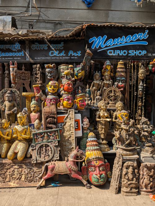 Free Vibrant collection of traditional sculptures and curios displayed at a shop in Mumbai, India. Stock Photo