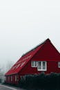 A red barn in the fog