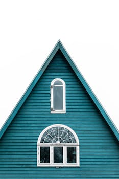 A minimalist shot of a blue gabled house facade in Copenhagen, Denmark.
