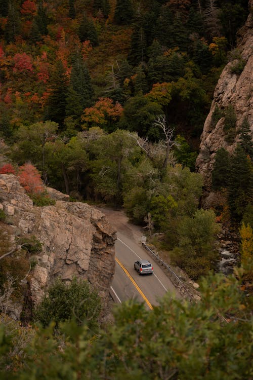 A car driving down a mountain road