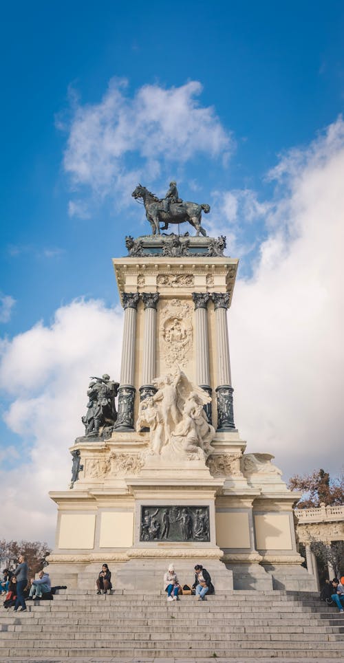 A monument with a statue on top of it