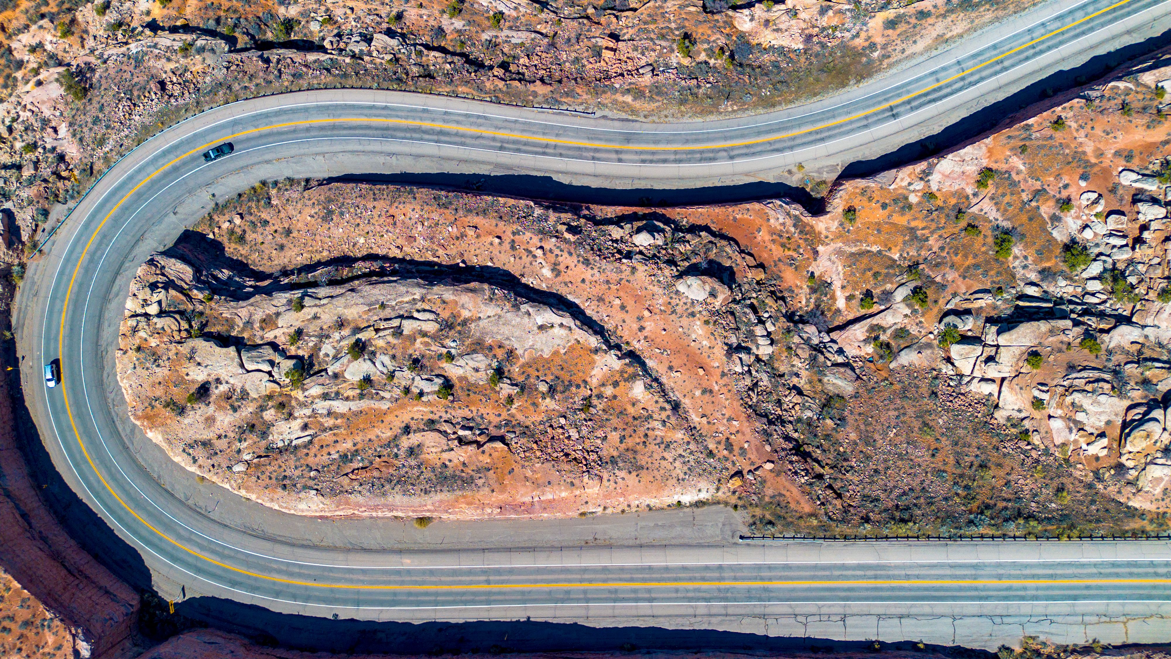 Amazing Bryce Canyon National Park 15-Minute Helicopter Tour Review: An Unforgettable Aerial Adventure Review 2026 - Aerial view of a winding road through the rocky desert landscape of Moab, Utah.
