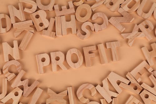 The word profit surrounded by wooden letters