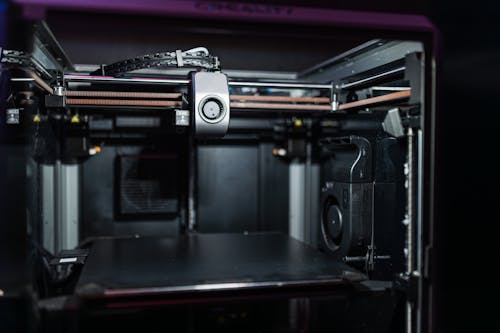 A close up of a 3d printer with a camera