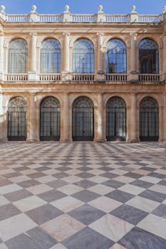 Stunning architectural courtyard in Seville with intricate stonework.