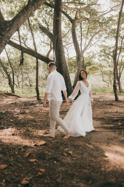 Free Married Couple Posing in a Forest Stock Photo