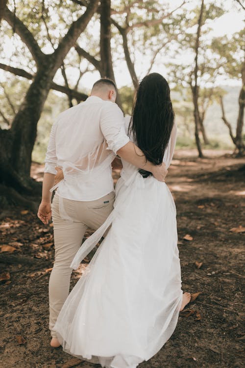 Free Just Married Couple Posing in a Forest Stock Photo