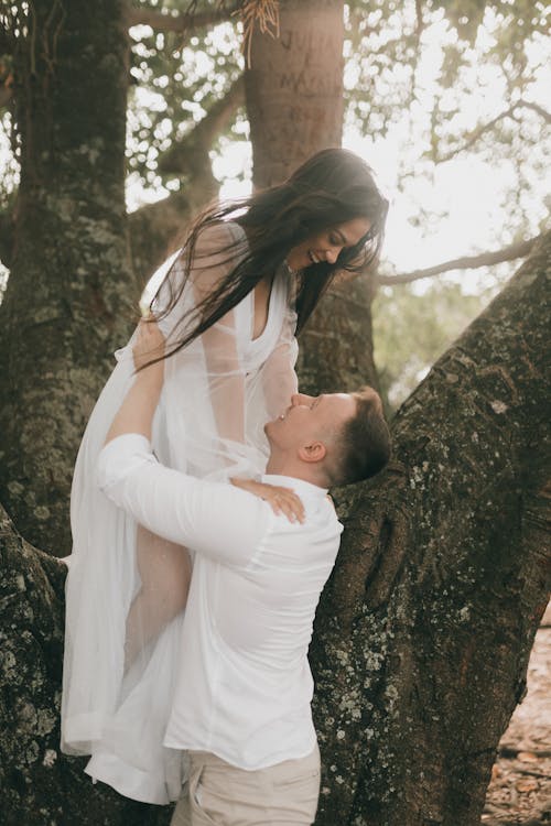 Free Just Married Couple Posing in a Forest Stock Photo