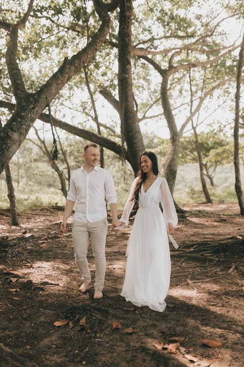 Free Just Married Couple Posing in a Forest Stock Photo