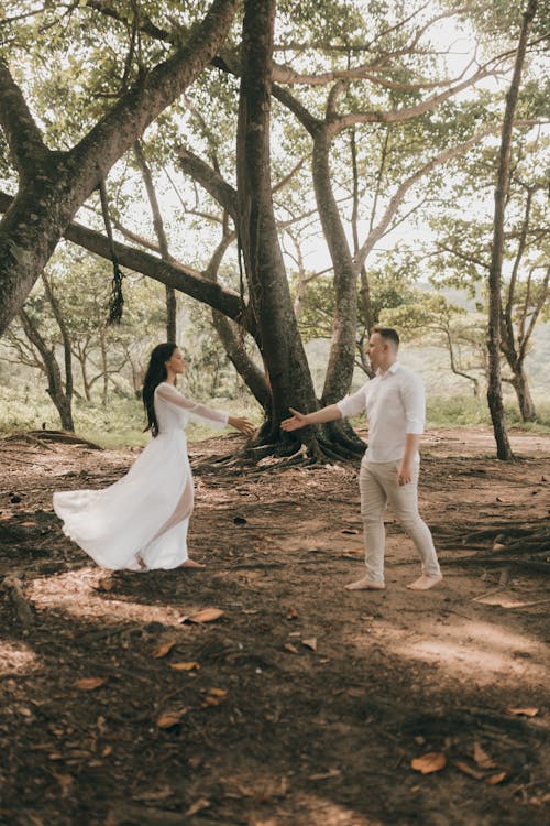 Free Just Married Couple Dancing in a Forest Stock Photo