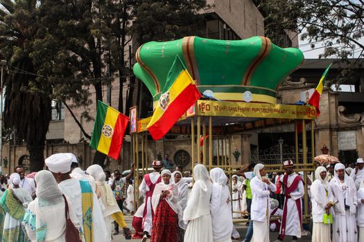 Colorful traditional parade in Addis Ababa, Ethiopia showcasing cultural attire and flags.
