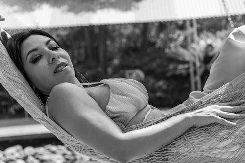 A woman in a hammock with her eyes closed