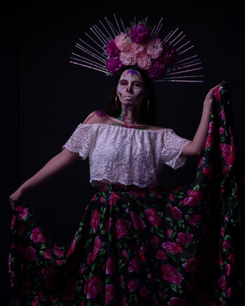 A woman in a floral dress and headpiece