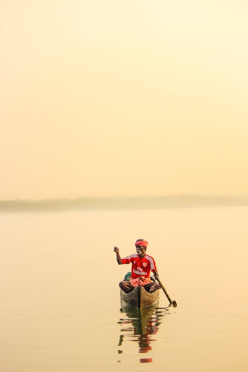 Man Riding Canoe