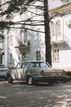 A Vintage Car in a Town