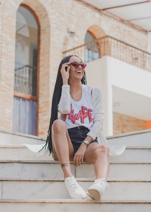 Woman Sitting on White Stair