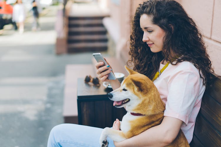 A Woman Holding A Smartphone 