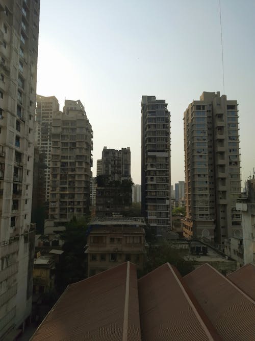 A view of tall buildings from a balcony
