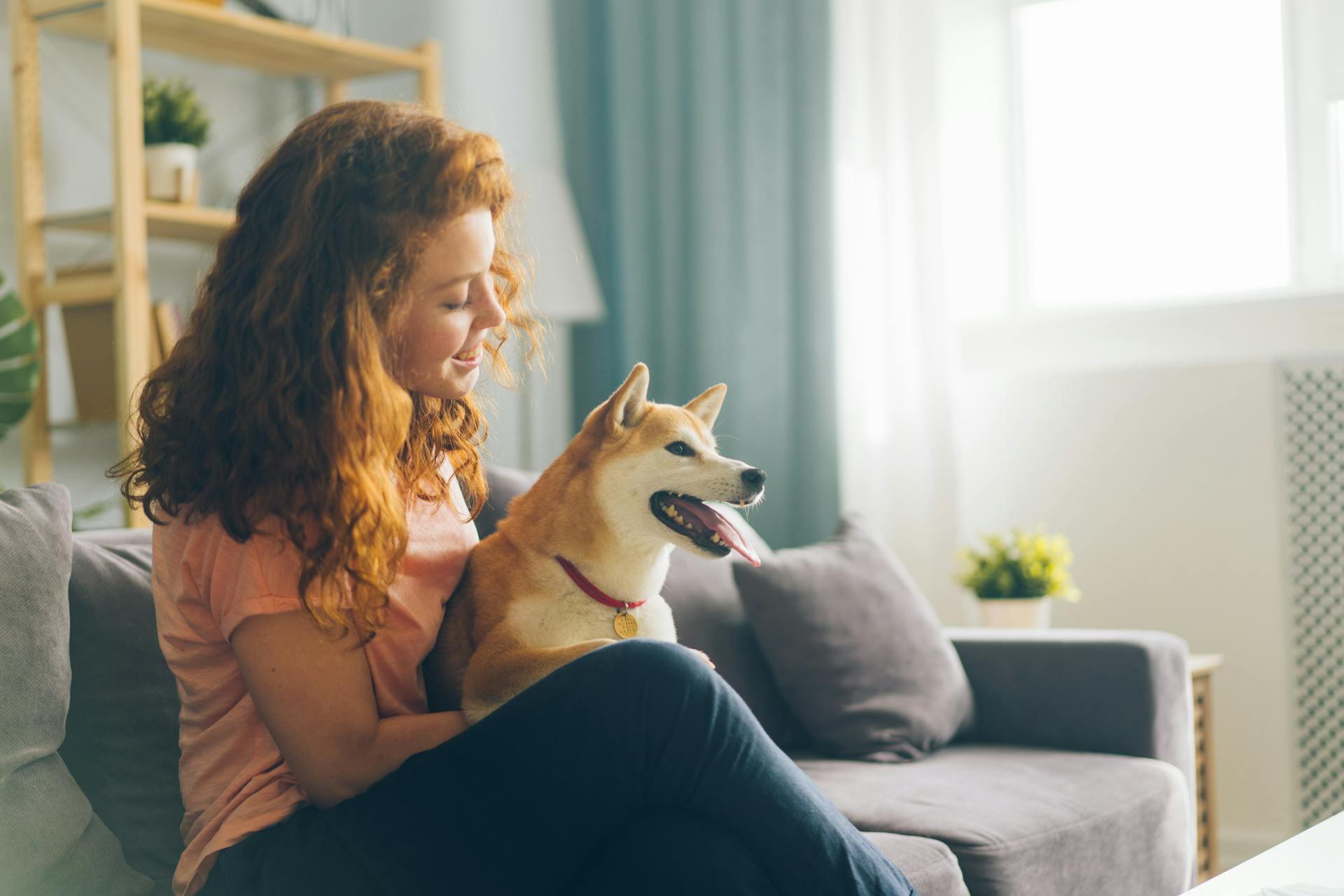 A Woman Sitting with a Pet