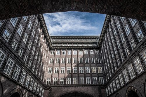 Free Explore the iconic courtyard of the Chilehaus, a UNESCO World Heritage site in Hamburg. Stock Photo