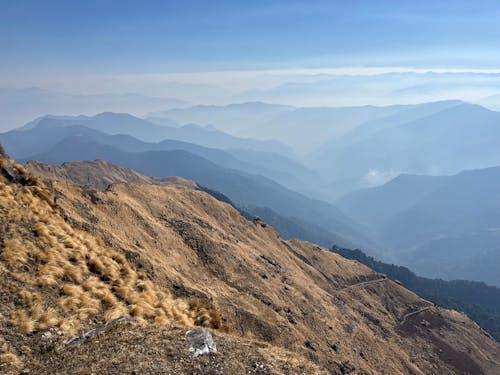 A view of the mountains from the top of a mountain