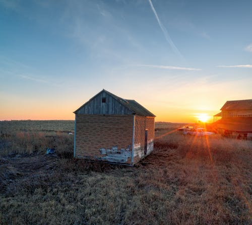 Brick Shed of an Abandoned Farm in the Light of the Setting Sun
