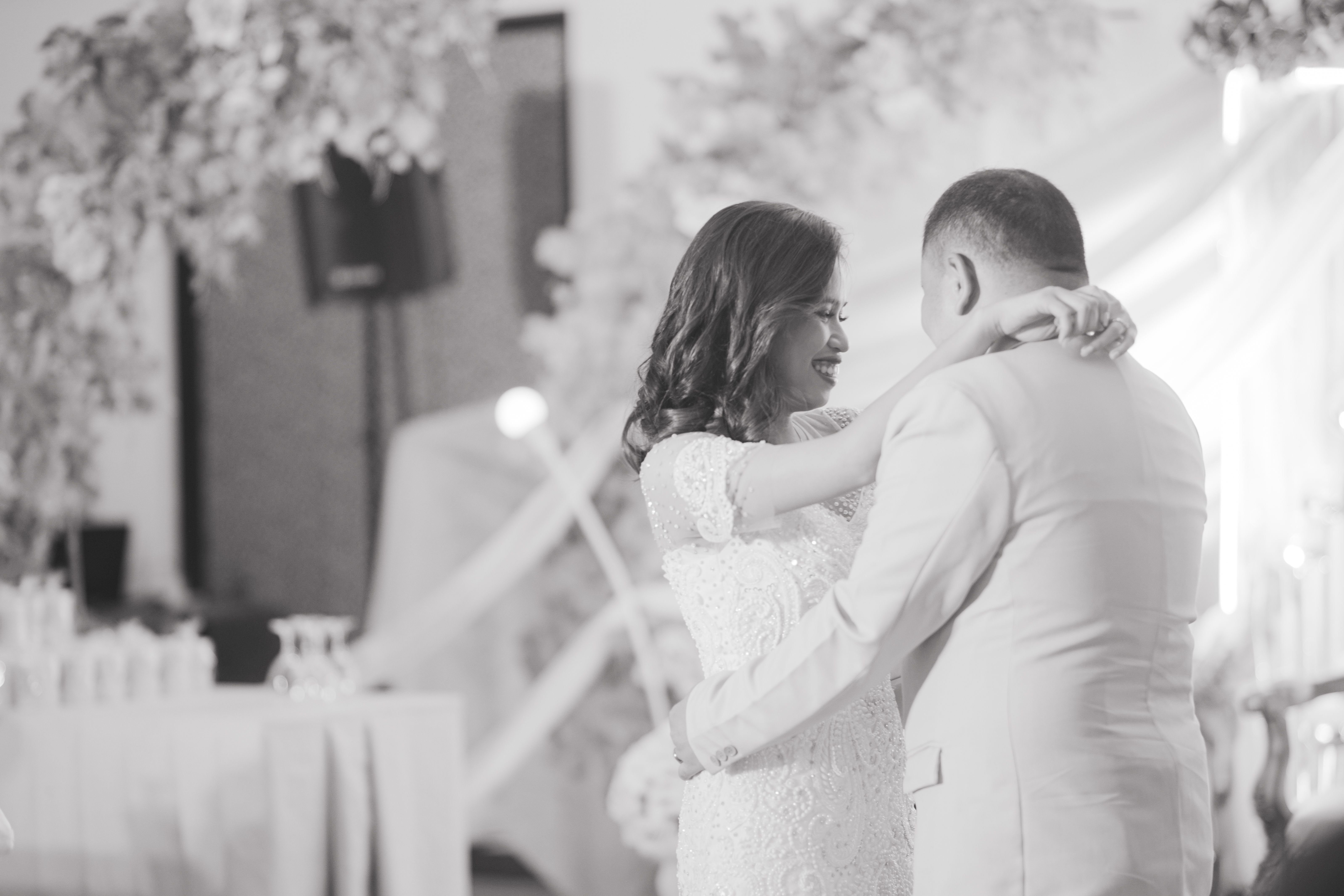Bride and groom sharing their first dance at an elegant wedding reception
