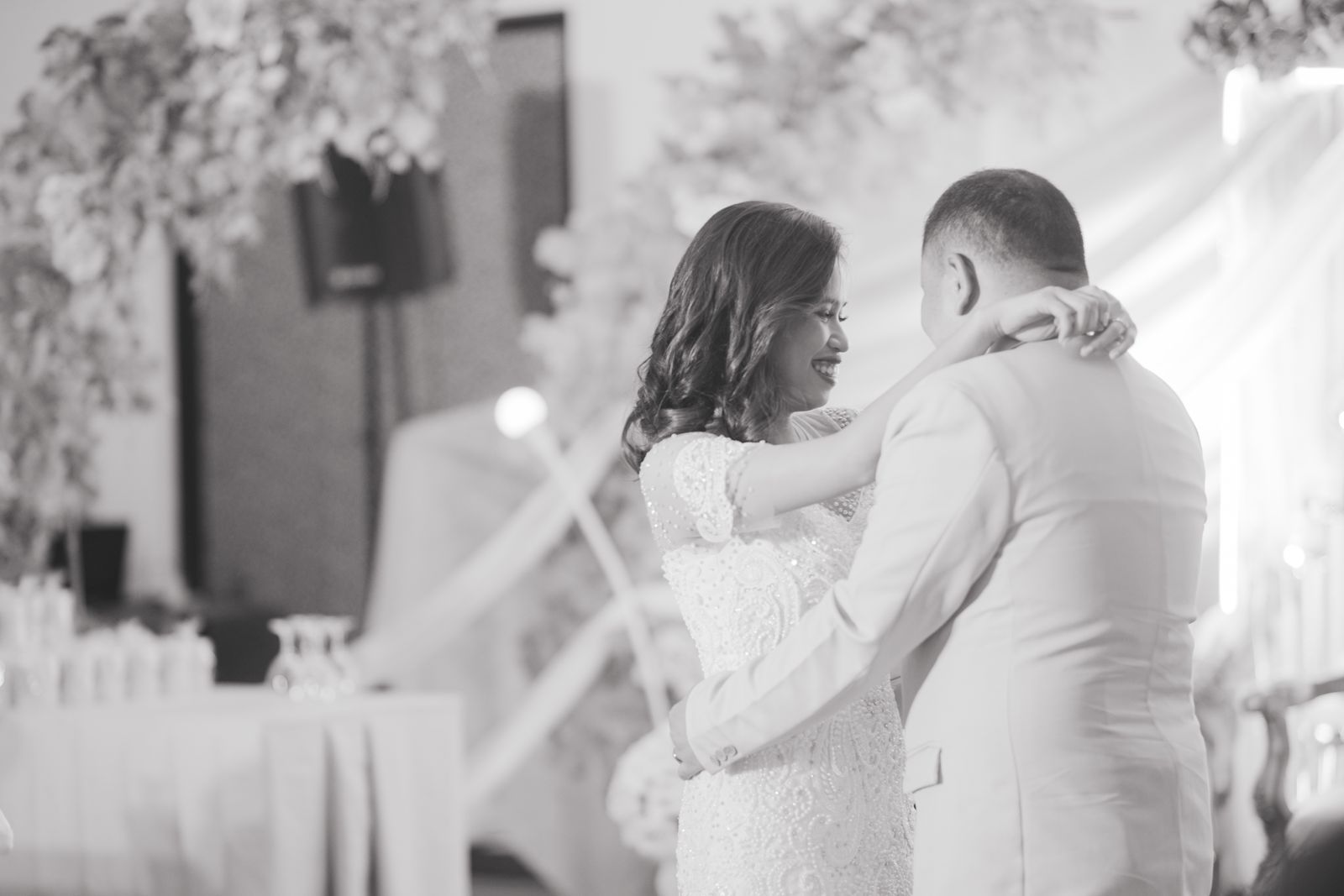 A newlywed couple sharing their first dance