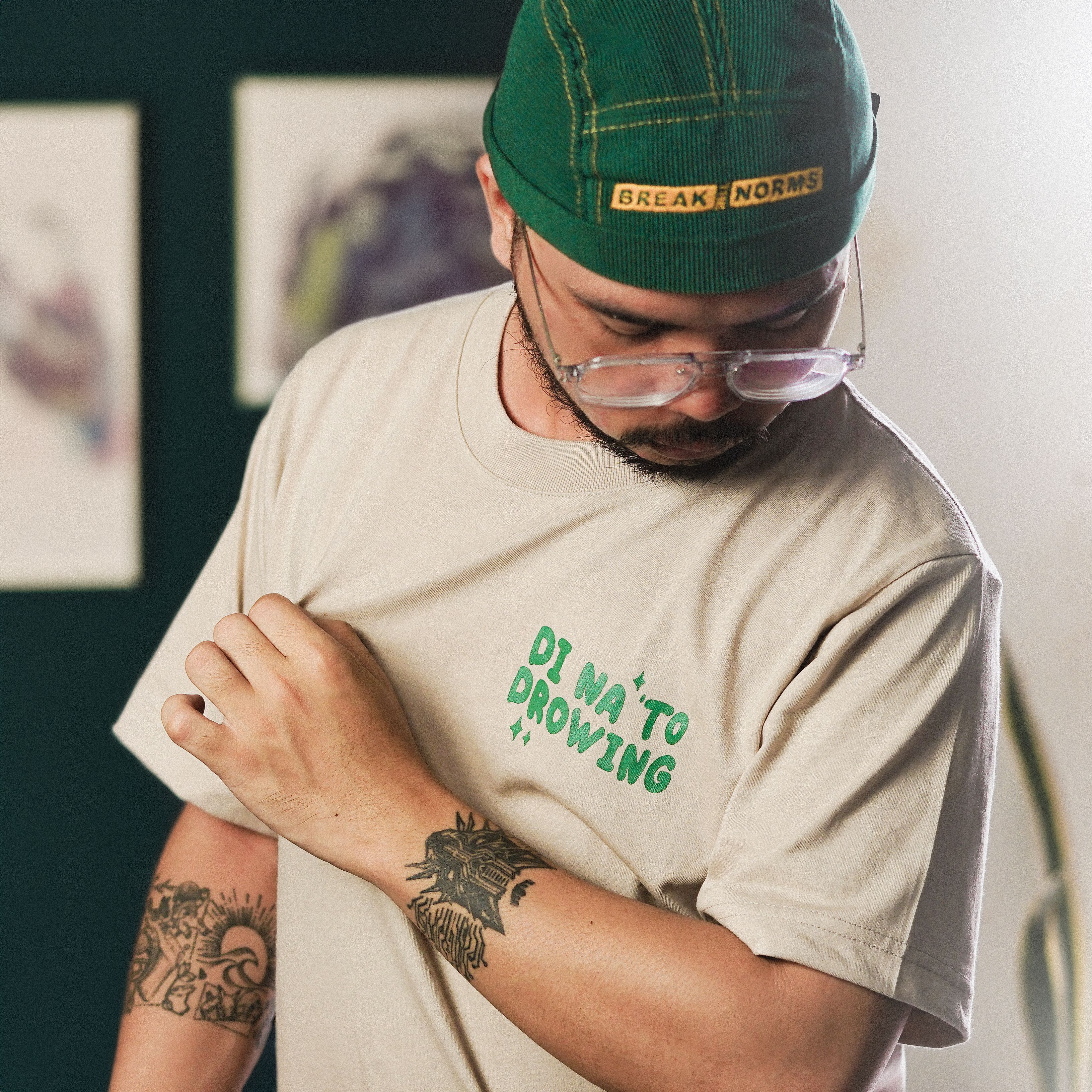 Portrait of Man in Hat, T-shirt and Eyeglasses