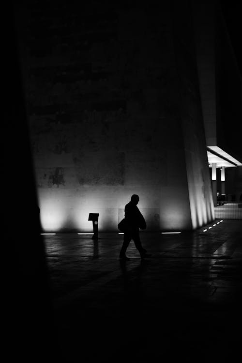 A man walking in the dark at night