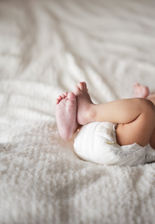 Close-up of a Newborn Baby Lying on a Soft Blanket 