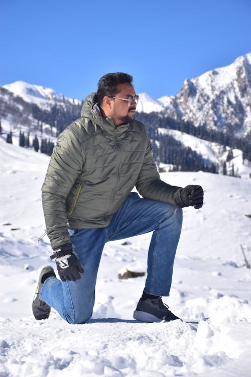 Man in a Mountain Valley in Winter 