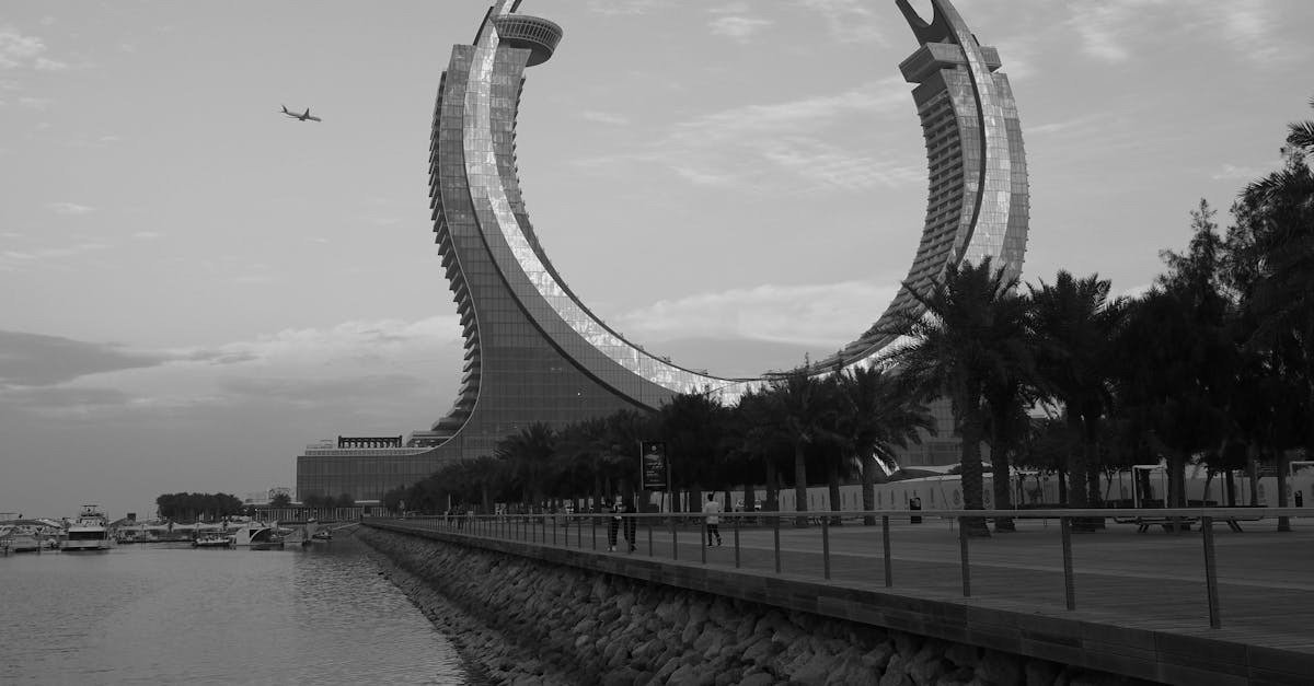 Black and white photo of a luxurious modern hotel landmark in Doha, Qatar.