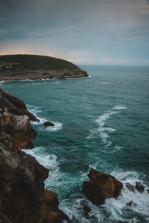 A photo of the ocean and cliffs